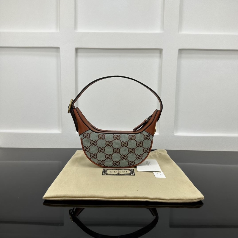 G*u*i top handle bags